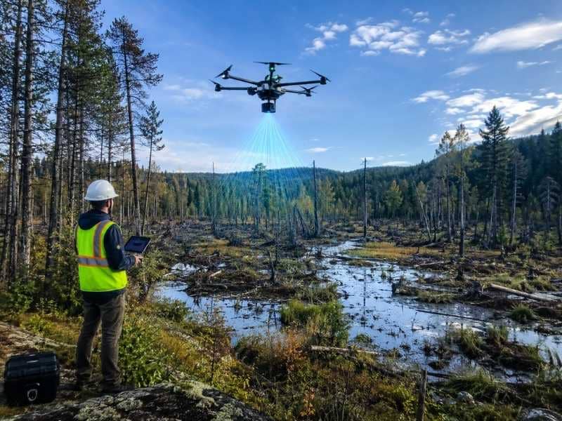 LiDAR Mapping using a drone to capture elevation data over wooded, swampy, and hard-to-reach properties for accurate land surveying and site planning.
