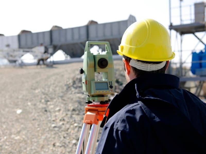 Topographic survey in Fort Myers showing existing grades and site conditions before relocating utilities around an existing building. 
